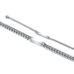 May include: Two silver-toned metal bracelets featuring a polished ID plate at the center. One bracelet has a thick, chunky curb chain, while the other features a thinner, delicate chain. Both bracelets include a lobster claw clasp closure.