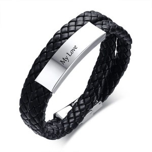 May include: Black leather bracelet with a silver plate engraved with the words "My Love".