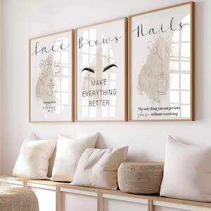 May include: Three framed art prints with beauty-themed text and line drawings. The prints say "Face", "Brows", and "Nails". The "Face" print has a line drawing of a face with flowers. The "Brows" print says "Make Everything Better". The "Nails" print says "The only thing you can get into shape without exercising".