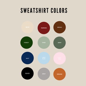 May include: A color chart showing 12 different sweatshirt colors. The colors are beige, maroon, brown, forest green, sage green, army green, navy blue, light blue, light pink, black, gray, and orange.