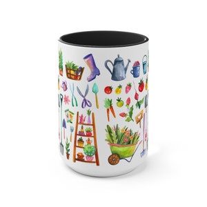 May include: White ceramic mug with a black rim featuring a colorful illustration of gardening tools, plants, and flowers. The design includes a watering can, a wheelbarrow, a ladder, gardening gloves, a rake, a shovel, and a variety of flowers and vegetables.