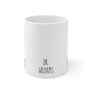 May include: White ceramic mug with black text that reads "DR. WILLIAMS".