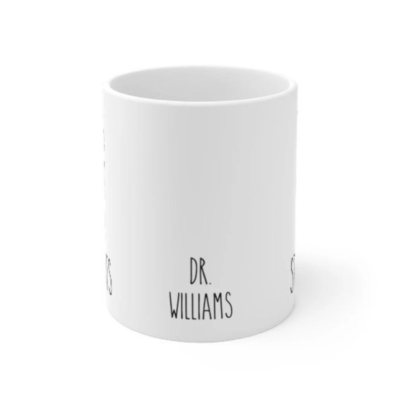May include: White ceramic mug with black text that reads "DR. WILLIAMS".