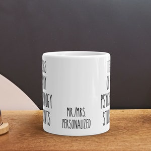 May include: White ceramic mug with black text that reads "Years of my Psychology Students Mr./Mrs. Personalized".