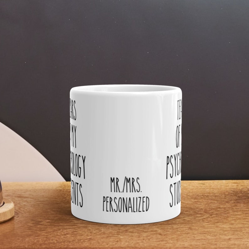 May include: White ceramic mug with black text that reads "Years of my Psychology Students Mr./Mrs. Personalized".
