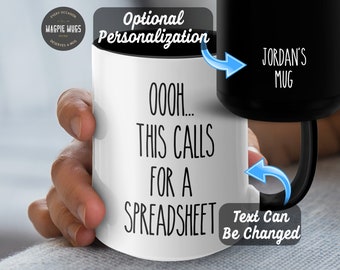 May include: White ceramic mug with black text that reads "OOOOH... THIS CALLS FOR A SPREADSHEET". The mug has a black handle and a black rim. The text "JORDAN'S MUG" is visible on the black rim. The text "Text Can Be Changed" is visible on the image.