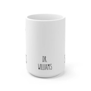 May include: White ceramic mug with black text that reads "DR. WILLIAMS".