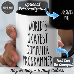 May include: White ceramic mug with black text that reads "World's Okayest Computer Programmer". The mug is 11 oz or 15 oz and comes in 6 colors. The text can be personalized.