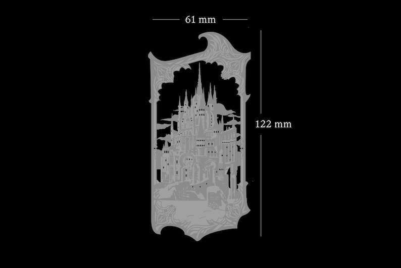 May include: A silver metal cutout of a detailed castle with a gothic design. The castle is surrounded by a decorative frame. The cutout measures 6.1 inches wide and 4.8 inches tall.