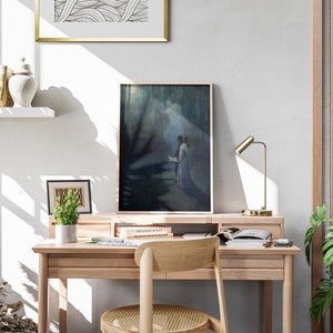 a desk with a chair and a painting on the wall