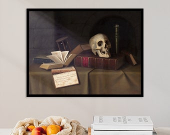 May include: A framed still life painting featuring a human skull atop a large, red-bound book. An open book, hourglass, and candle are also on the table. The painting has a dark, moody aesthetic.