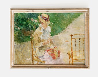 May include: A painting of a woman in a straw hat sitting on a chair in a garden setting. She is wearing a light yellow jacket and a white blouse. The chair is made of bamboo and has a light brown finish. The background is a blur of green foliage and a light brown path.