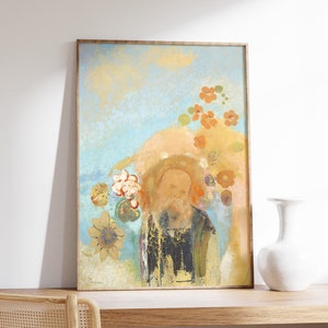 May include: A framed painting of a man with a beard, surrounded by flowers in shades of pink, orange, and yellow. The background is a soft blue with hints of gold.