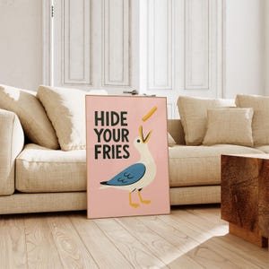 a picture of a bird on the floor next to a couch