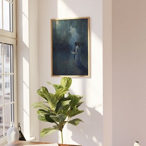 a painting hanging on a wall next to a potted plant