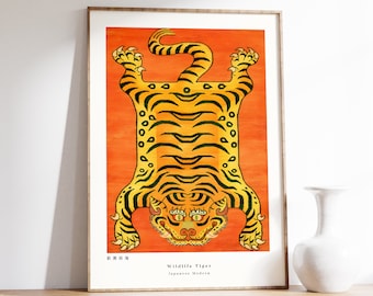 May include: A framed print of a tiger rug with a bright orange background. The tiger is yellow with black stripes and has a green face. The text "Wildlife Tiger" and "Japanese Modern" is printed below the tiger.
