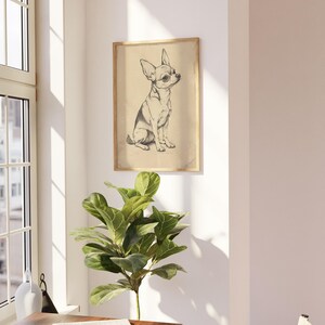a small dog is hanging on the wall above a table