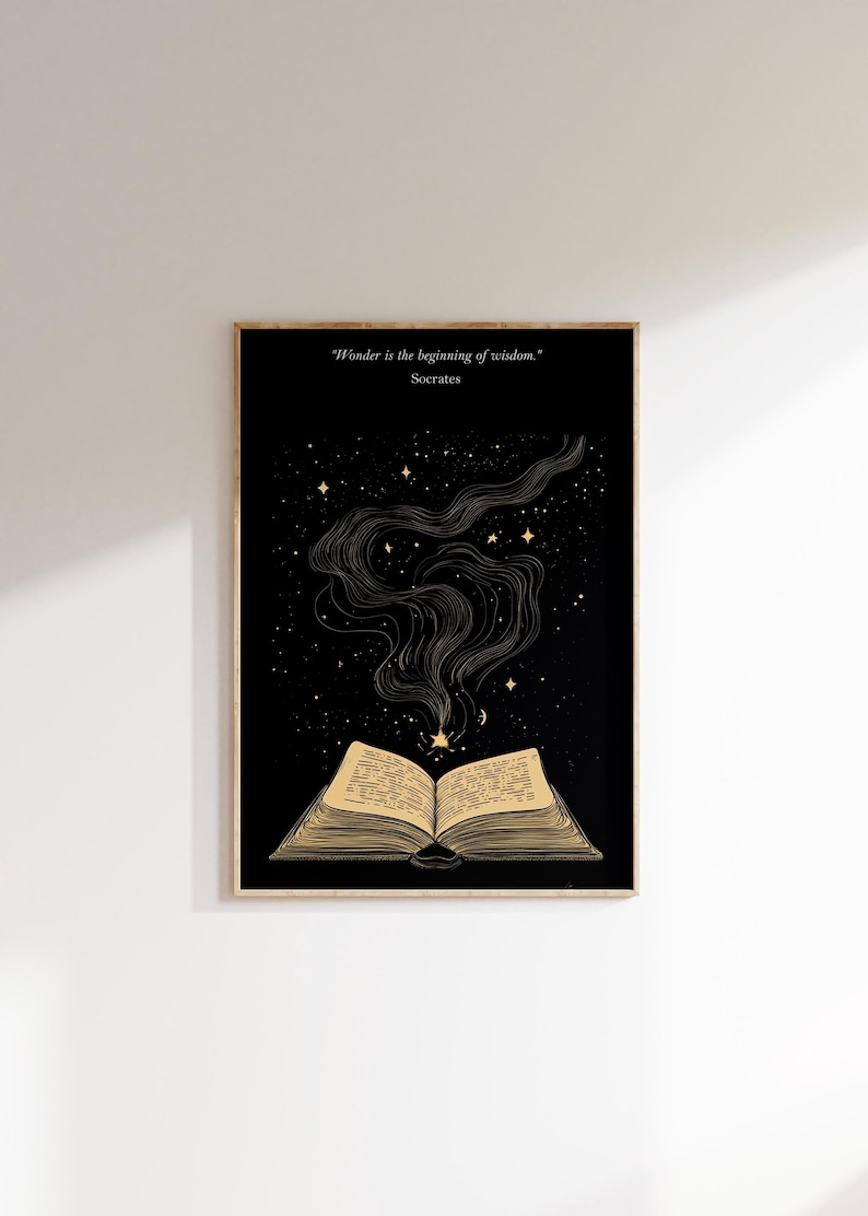 May include: A black and gold print with an open book and stars. The quote "Wonder is the beginning of wisdom." by Socrates is at the top of the print.