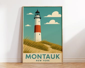 May include: A framed art print featuring a lighthouse with red and white stripes, set against a teal sky with clouds. The print includes the text "MONTAUK NEW YORK" in a beige font, and is set on a wooden floor.