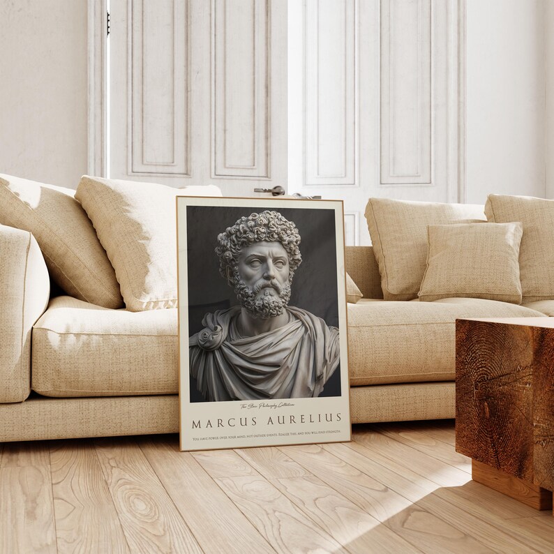 May include: A black and white poster featuring a bust of Marcus Aurelius, a Roman emperor and philosopher. The poster has a gold frame and the text "The Stoic Philosophy Collection MARCUS AURELIUS" at the bottom.