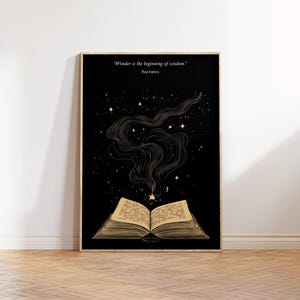 May include: A black and gold print with an open book and stars. The quote "Wonder is the beginning of wisdom." by Socrates is at the top of the print.