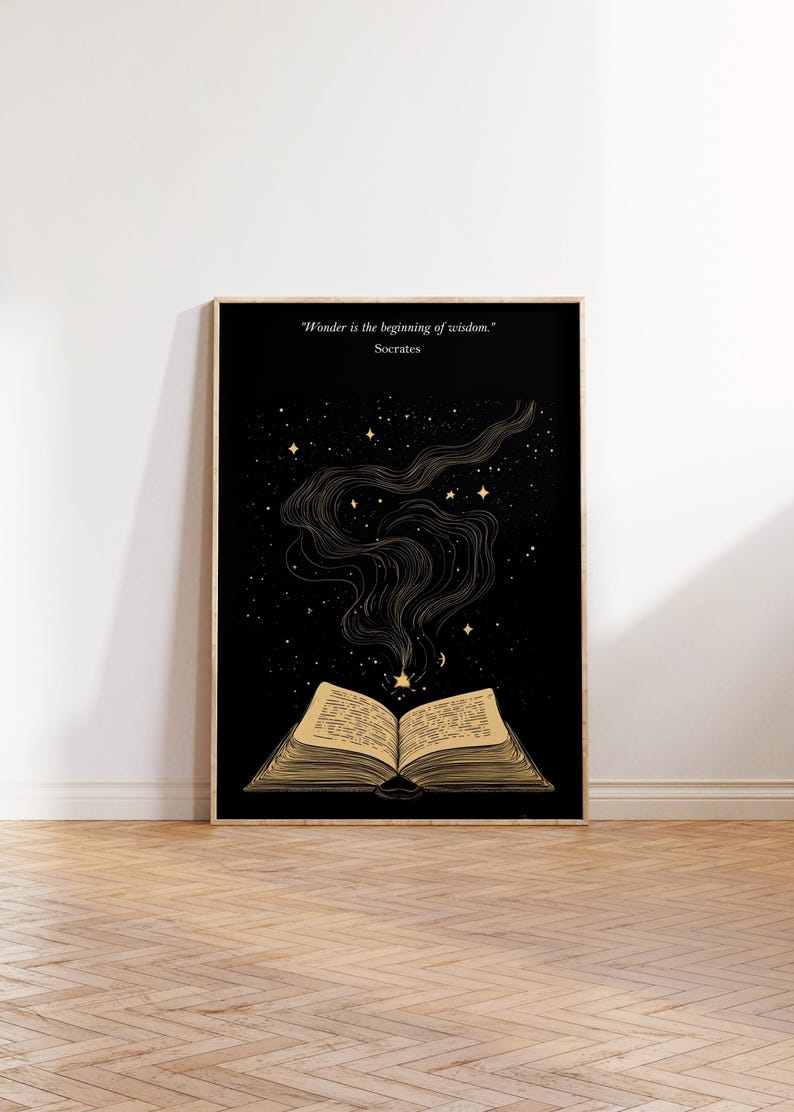 May include: A black and gold print with an open book and stars. The quote "Wonder is the beginning of wisdom." by Socrates is at the top of the print.