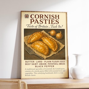May include: A framed print featuring Cornish pasties, a British specialty. The image shows golden-brown pastries on parchment paper, accompanied by onions and a fork. Text includes "Cornish Pasties" and ingredients.