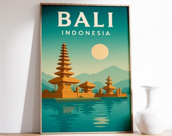 May include: A framed art print featuring a stylized illustration of Bali, Indonesia. The artwork showcases a traditional temple complex on a lake, with a sun and mountains in the background. The text "BALI INDONESIA" is at the top.