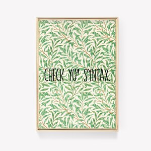 May include: A framed print with a green and white floral pattern and the text "CHECK YO' SYNTAX."