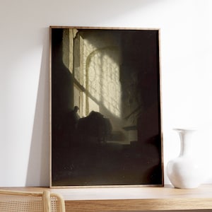 May include: A framed painting of a dark room with a window letting in light. The light shines through a patterned window pane and casts shadows on the floor. A figure sits in the room, partially obscured by the shadows.