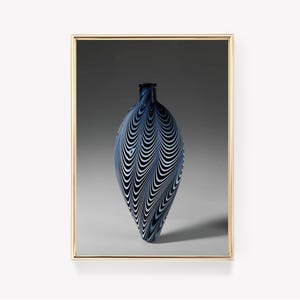 May include: A blue and white glass vase with a swirling pattern. The vase is shaped like a teardrop and has a narrow neck.