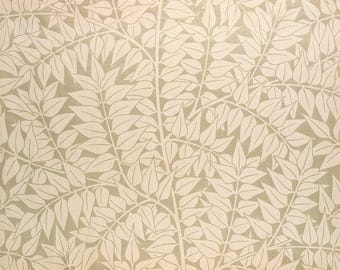 May include: A beige background with a white leaf pattern. The leaves are stylized and have a delicate, almost lace-like appearance.