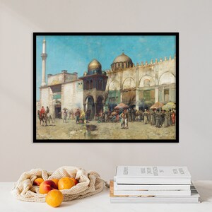 May include: A painting depicting a bustling street scene in a Middle Eastern city. The scene features a mosque with a tall minaret, a courtyard with people gathered, and a variety of shops and stalls. The painting is done in a realistic style with vibrant colors.