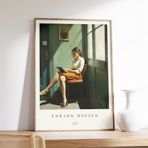 May include: A framed print of a painting by Edward Hopper titled "Echo". The painting depicts a woman sitting in a chair, reading a book, in a room with a door and a window. The room is painted in shades of green and brown.