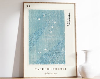May include: A blue and white woodblock print of a Japanese landscape with birds flying over a mountain range. The print is titled "Taguchi Tomoki" and dated "Woodblock, 1860".