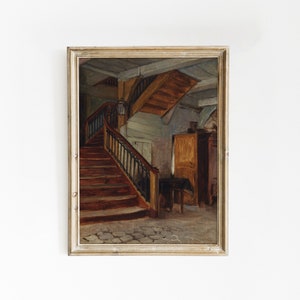 May include: A painting of a wooden staircase with a black metal railing in a room with a wooden door and a wooden cabinet. The painting is framed in a light wood frame.