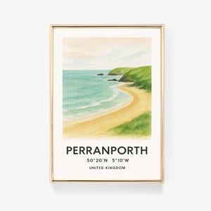 May include: Watercolor print of Perranporth beach in the United Kingdom, framed in gold. The artwork depicts a sandy beach, turquoise water, and green cliffs under a soft, pastel sky. Text at the bottom reads "Perranporth" and coordinates.