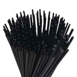 May include: A bunch of black diffuser sticks. The sticks are bundled together and are about 8 inches long.