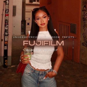 May include: A woman in a white top and blue jeans holds a green drink in a clear glass. The image includes the text "FUJIFILM" and "MOBILE & DESKTOP". The background features a brick wall and graffiti.