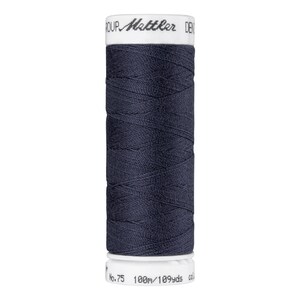 May include: A spool of dark blue thread with the text "Mettler" on the label. The spool is labeled "No. 75 100m/109yds".