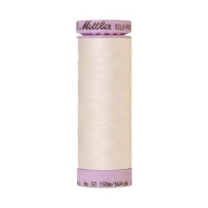 May include: A spool of white thread with a purple label that reads "Mettler Silk-Finish No. 50 150m/164 yds".