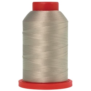 May include: A spool of light gray thread with a red plastic bobbin.