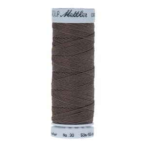 May include: A spool of brown thread with the text "Mettler" and "No. 30" on the label.