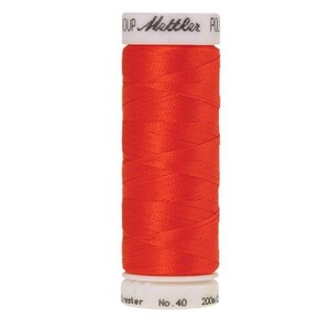 May include: A spool of bright orange thread with a white label that reads "Mettler Polyster No. 40 200m/219yd".