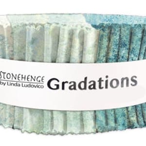 May include: A roll of fabric featuring a gradation of blue and white colors. The fabric is labeled "Stonehenge Gradations by Linda Ludovico".