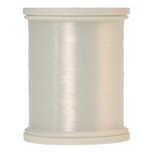 May include: A spool of white thread on a white plastic bobbin.
