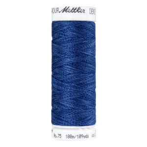 May include: A spool of dark blue thread, labeled "Mettler" and "No.75 100m/109yds col.". The thread is tightly wound around a white spool, with the brand name printed in a stylized font. The thread is a solid, rich blue color.