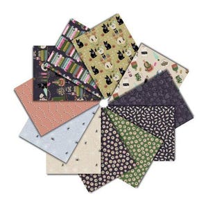 May include: A collection of fabric squares arranged in a circular pattern. The fabrics feature various patterns, including books, cats, spiders, and floral designs. Colors include pink, blue, green, and black.