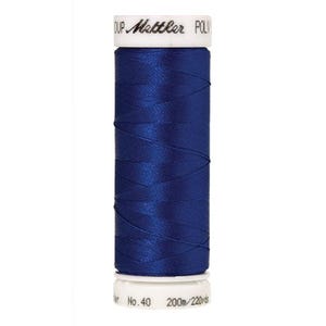 May include: A spool of dark blue thread with the text " Gütermann POLY" and "No. 40 200m/220yds" printed on the label.