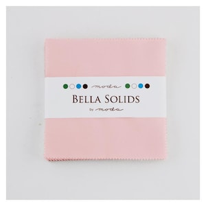 May include: A pink fabric square with the text "BELLA SOLIDS by moda" on a white label. The label also has a row of colored circles.